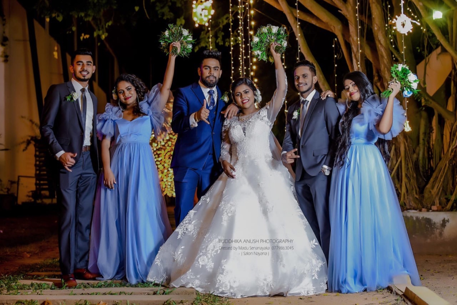 Bride, groom and wedding party dressed for an evening celebration